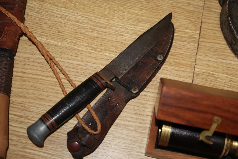 A quantity of mixed collectables including a planished pewter box, a draughtsman set, a large padlock and key, daggers etc